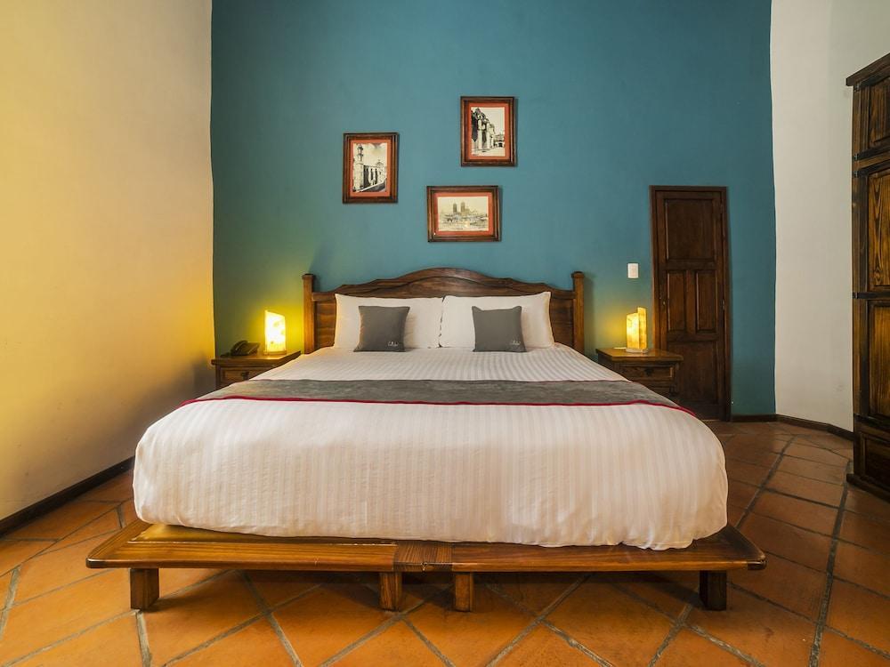 Collection O Al Otro Lado Del Rio, Puebla Hotel ภายนอก รูปภาพ A bedroom at the hotel