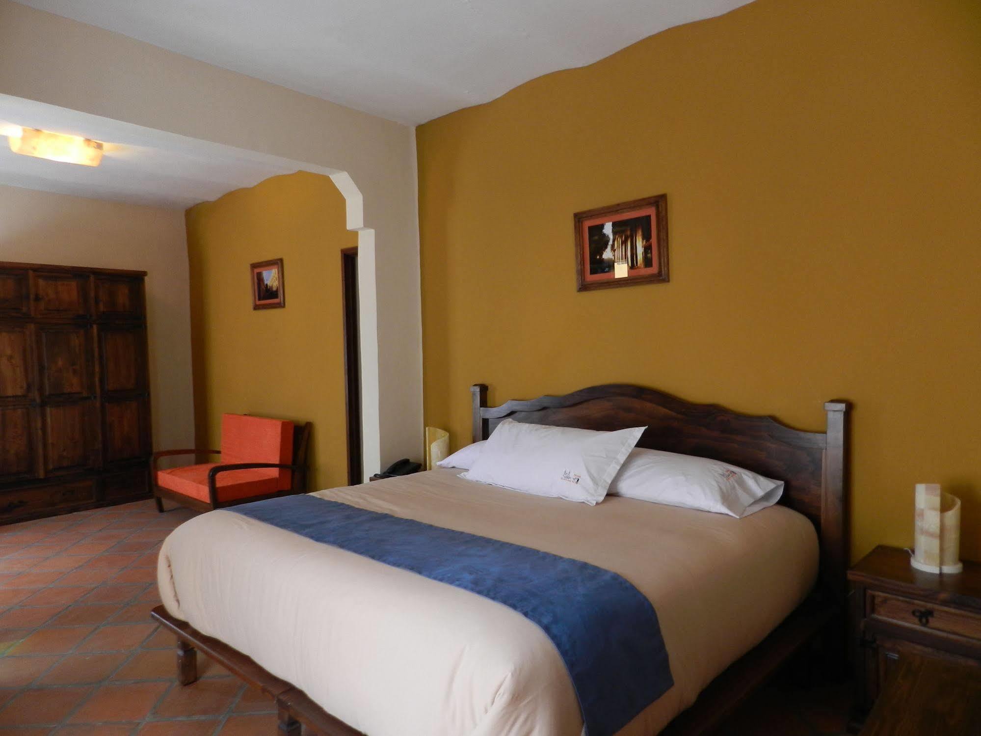 Collection O Al Otro Lado Del Rio, Puebla Hotel ภายนอก รูปภาพ A bedroom at the hotel