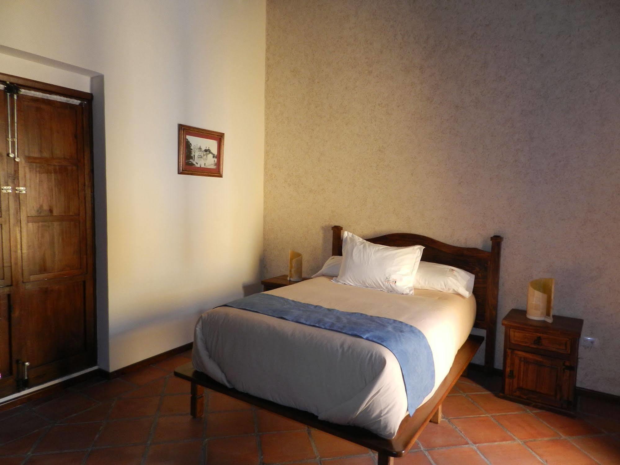 Collection O Al Otro Lado Del Rio, Puebla Hotel ภายนอก รูปภาพ A room at the hotel