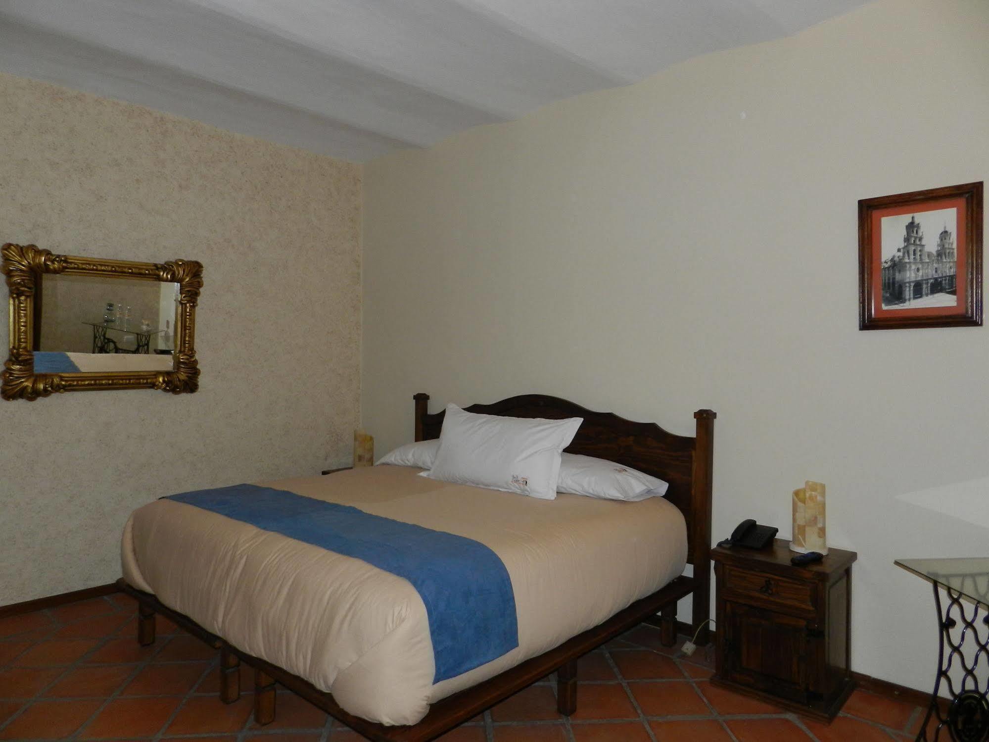 Collection O Al Otro Lado Del Rio, Puebla Hotel ภายนอก รูปภาพ A room at the hotel